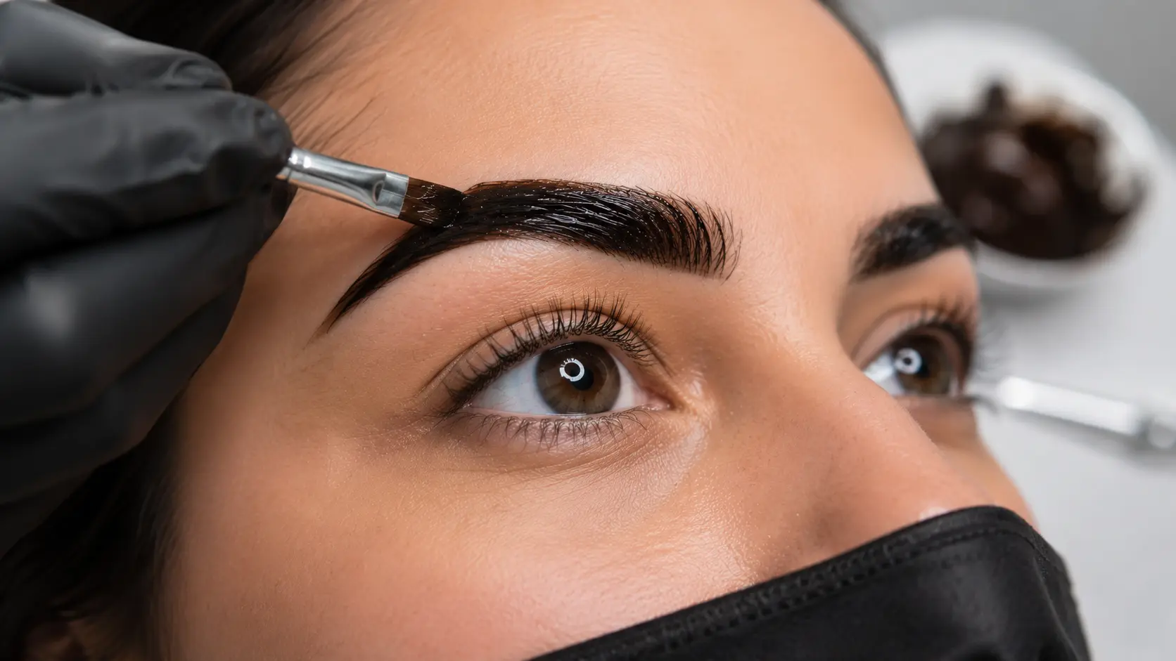 Eyebrow tinting result showing darker and more defined brows