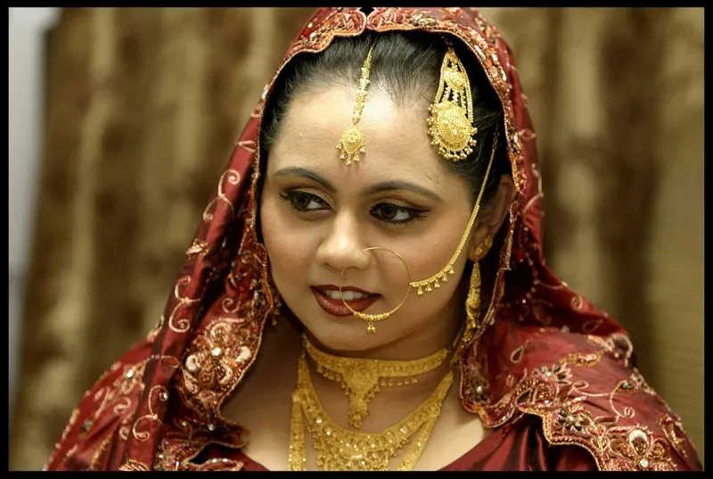 Indian bride wearing traditional bridal jewelry and makeup