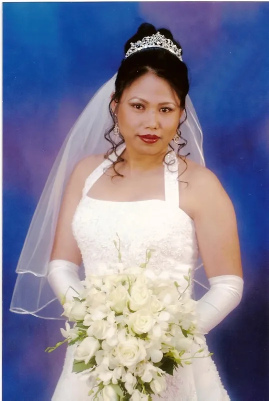 Bride in white wedding gown with bridal makeup and hairstyle