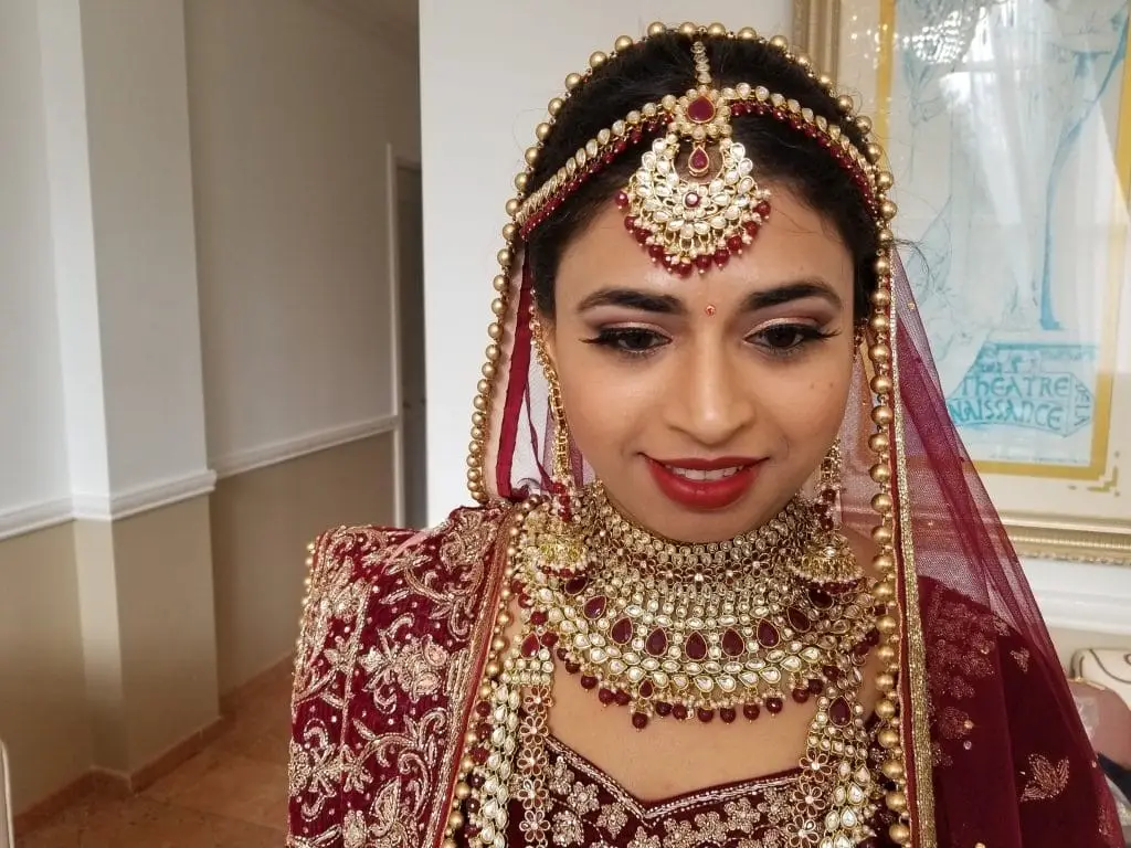 Indian bride with traditional bridal makeup and wedding jewelry