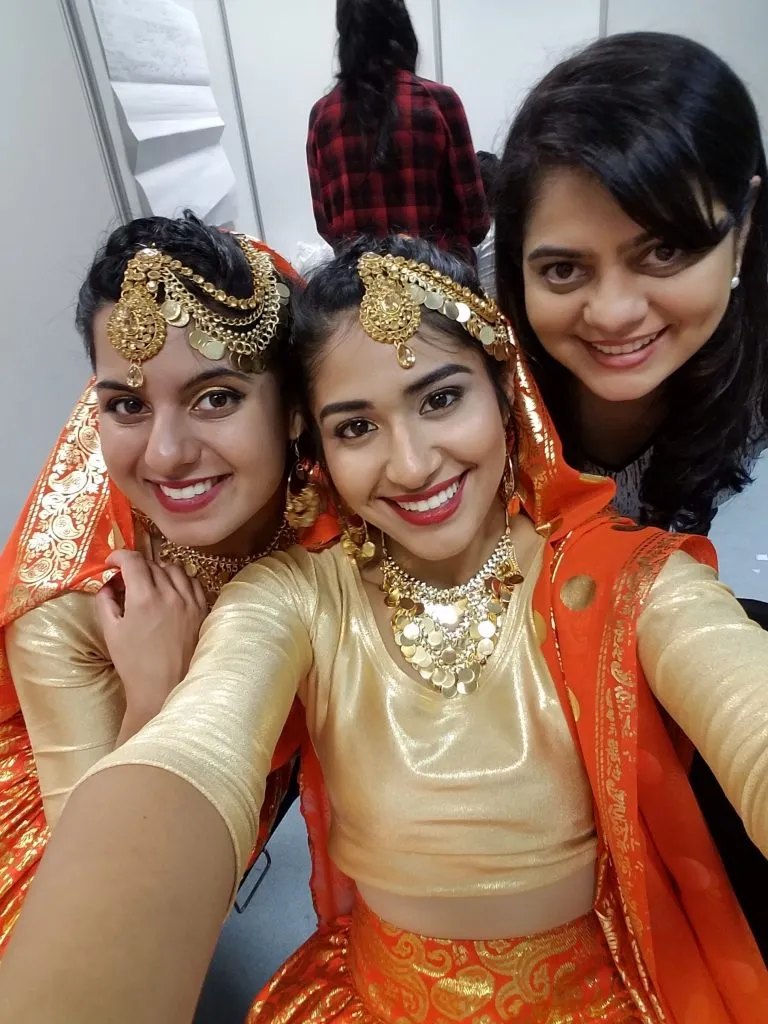 Bridal makeup artist and models showcasing completed wedding styling