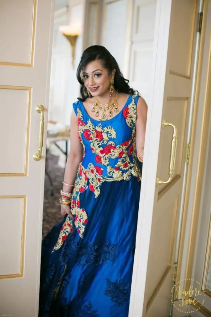 Wedding guest makeup and hairstyling in elegant blue dress